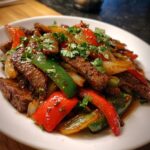 Sizzling Chinesisches Pfeffersteak mit Zwiebeln